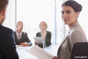 Portrait confident corporate businesswoman in conference room meeting