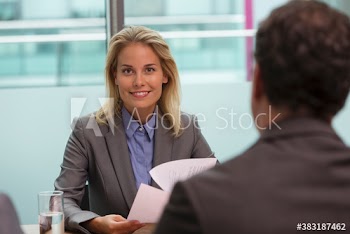 Portrait confident corporate businesswoman in meeting