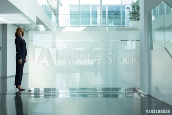 Portrait confident corporate businesswoman in modern office
