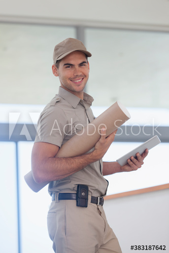 Portrait confident deliveryman with digital tablet and tube package