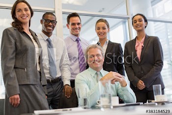 Portrait confident diverse corporate business people in meeting