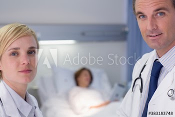 Portrait confident doctors making rounds in hospital