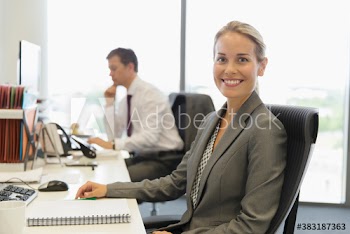 Portrait confident female businesswoman working in office