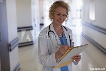 Portrait confident female doctor making rounds in hospital