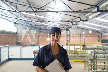 Portrait confident female manager in warehouse