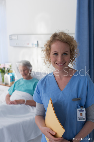 Portrait confident female nurse checking on senior patient in hospital room