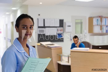 Portrait confident female nurse in hospital
