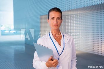 Portrait confident female scientist with clipboard