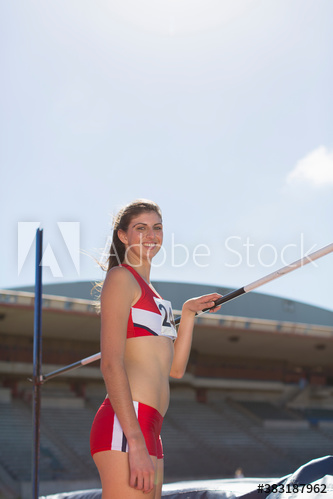 Portrait confident female track and field athlete practicing high jump