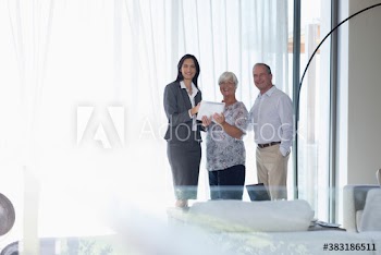 Portrait confident financial advisor meeting with senior couple