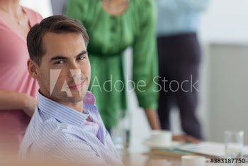 Portrait confident handsome young businessman