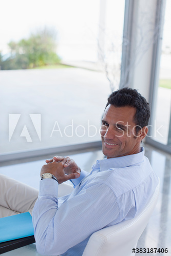 Portrait confident male architect working in office