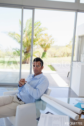 Portrait confident male architect working in office