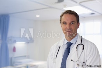 Portrait confident male doctor in hospital