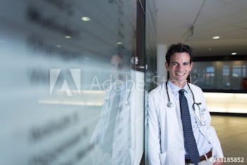 Portrait confident male doctor in hospital