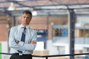 Portrait confident male supervisor in factory