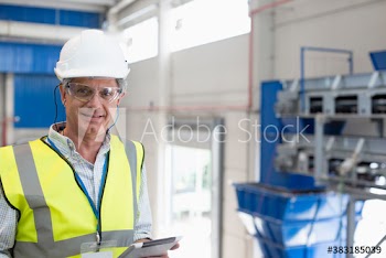 Portrait confident male supervisor with digital tablet in warehouse
