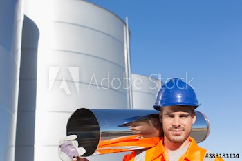 Portrait confident male worker carrying stainless steel canister