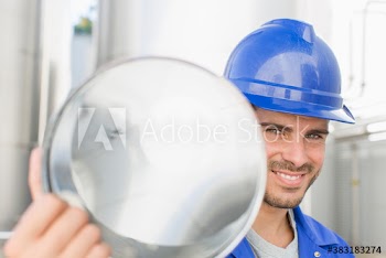 Portrait confident male worker carrying steel canister