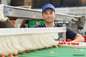 Portrait confident male worker in food processing plant