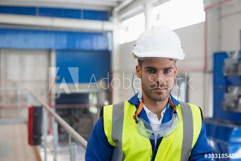 Portrait confident male worker in protective workwear in factory