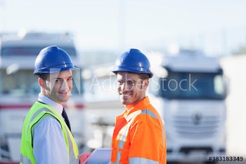 Portrait confident male workers in hard hats and reflective clothing