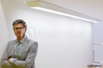 Portrait confident mature corporate businessman in suit