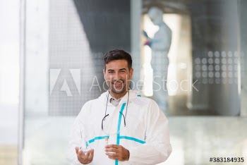Portrait confident medical scientist with beaker
