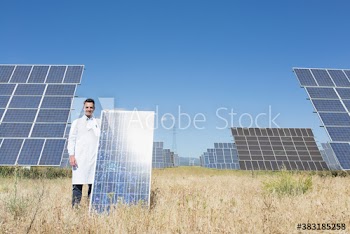 Portrait confident scientist with solar panel in sunny field