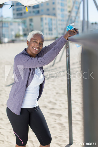 Portrait confident senior woman exercising on beach
