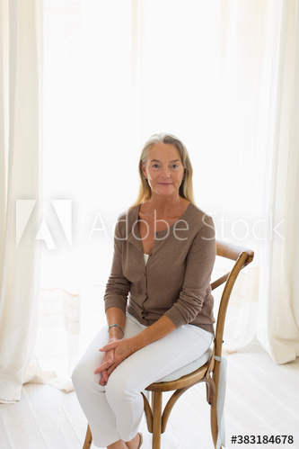 Portrait confident senior woman in chair