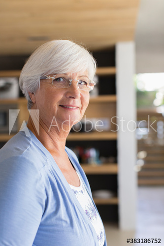 Portrait confident senior woman in eyeglasses