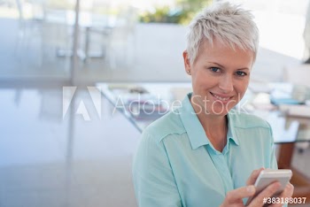 Portrait confident woman with smart phone