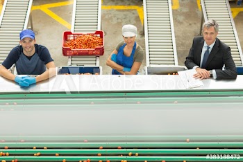 Portrait confident workers and manager in food processing plant