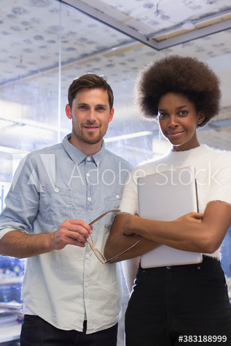 Portrait confident young business people in office