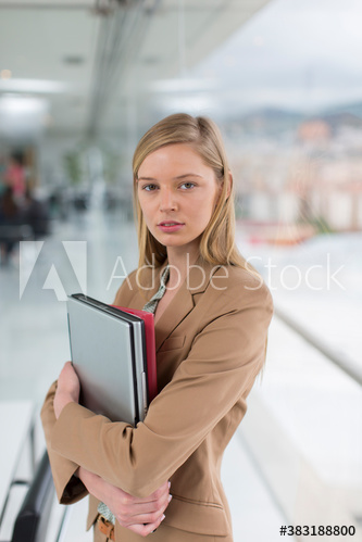 Portrait confident young businesswoman in office