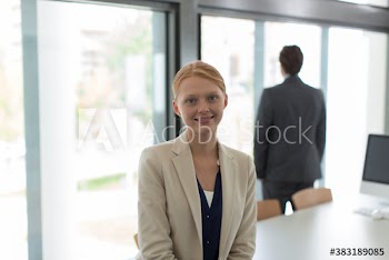 Portrait confident young businesswoman in office