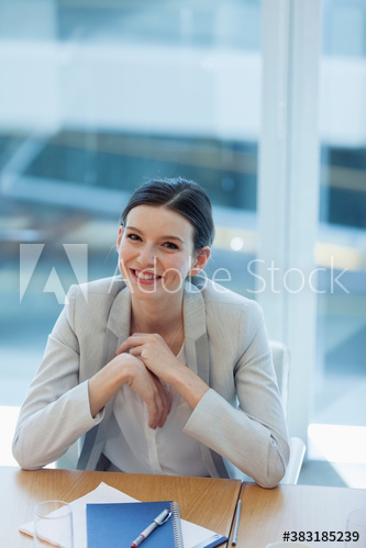 Portrait confident young corporate businesswoman in office