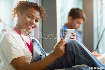 Portrait confident young female college student with digital tablet