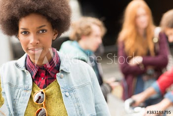 Portrait confident young woman with afro