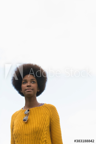 Portrait confident young woman with afro
