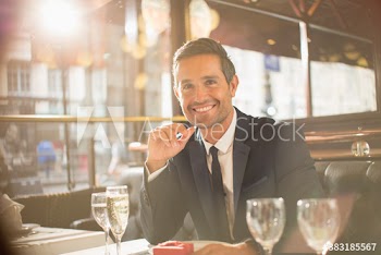 Portrait excited man preparing to propose in restaurant