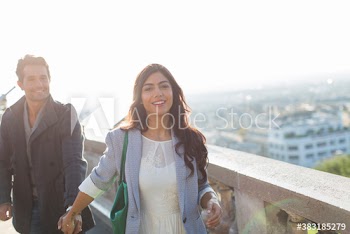 Portrait happy couple holding hands, Montmartre, Paris, France