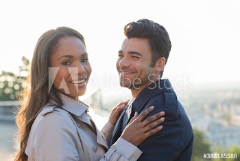 Portrait happy couple hugging