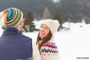 Portrait happy couple in snow