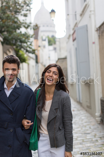 Portrait happy couple walking in Montmartre, Paris, France