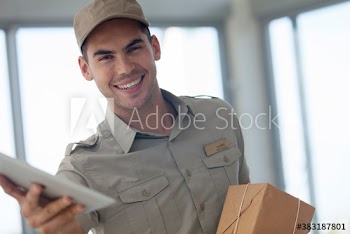 Portrait happy delivery man with digital tablet and package