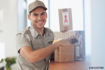 Portrait happy deliveryman with packages