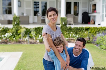 Portrait happy family in backyard