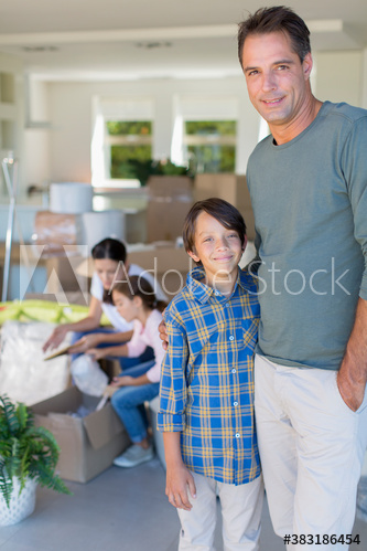 Portrait happy family moving into new house